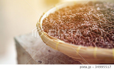 Purple rice, riceberry in rattan basket Purple rice, riceberry in rattan basket 34995517