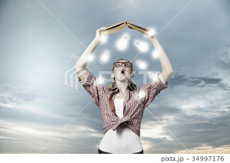 Girl excited with book Girl excited with book 34997176