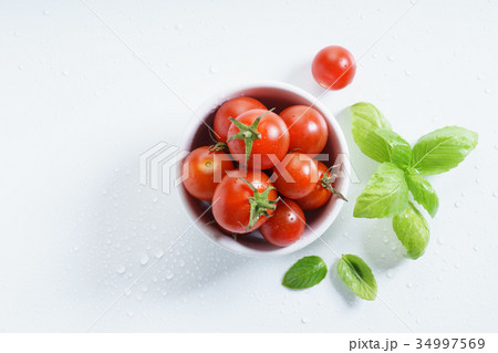 fresh tomatoes. 34997569