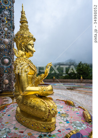 Outdoor Golden Buddha Image in beautiful temple 34998052