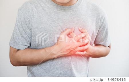 a man touching his heart, heart disease a man touching his heart, heart disease 34998416