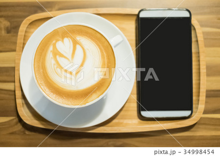 close up coffee and phone close up coffee and phone 34998454