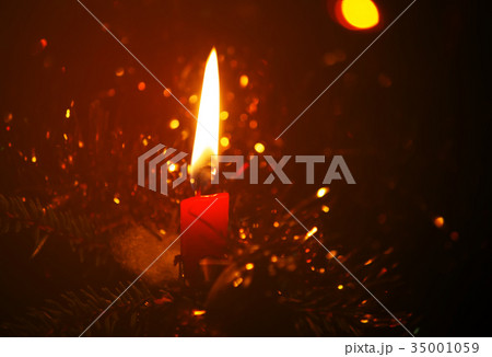 Burning candle flame 35001059