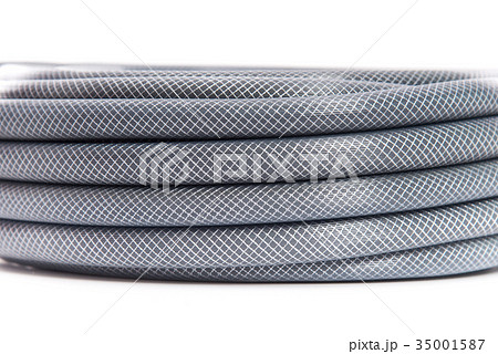 curled garden hose isolated on white 35001587