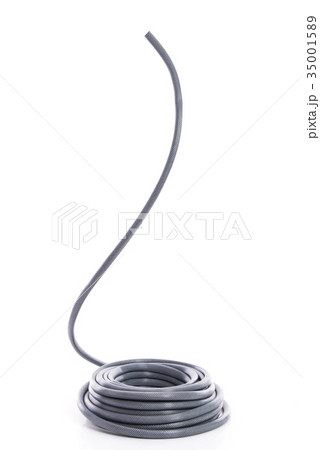 curled garden hose isolated on white 35001589