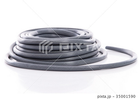 curled garden hose isolated on white 35001590