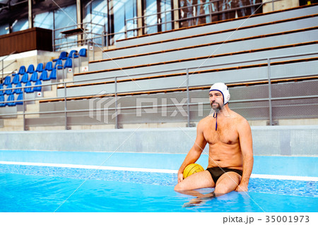 Water polo player in a swimming pool. 35001973