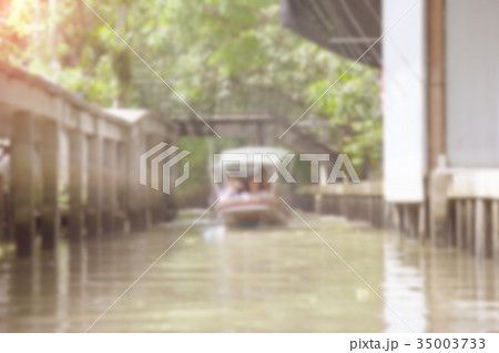 Canal in countryside wiht boat blur background Canal in countryside wiht boat blur background 35003733