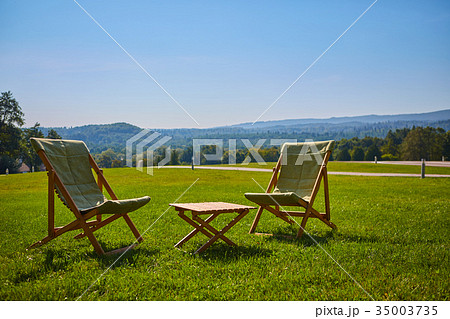 Relax with wooden chair and table. Enjoy the view Relax with wooden chair and table. Enjoy the view 35003735