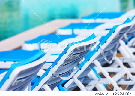 Row of beach chairs and swimming pool 35003737