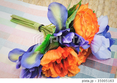 Orange Artificial Ranunculus with Blue Flowers Orange Artificial Ranunculus with Blue Flowers 35005163