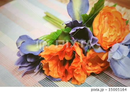 Orange Artificial Ranunculus with Blue Flowers 35005164