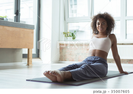 Beaming lady resting after practicing sport Beaming lady resting after practicing sport 35007605