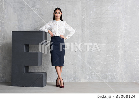 Serious young lady locating near big E 35008124