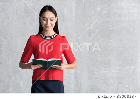 Charming woman is enjoying favorite novel Charming woman is enjoying favorite novel 35008337