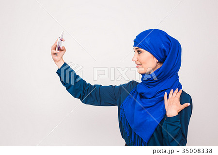Portrait of beautiful muslim young woman wearing Portrait of beautiful muslim young woman wearing 35008338