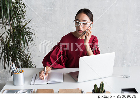 Confident stylish girl is having business 35009079