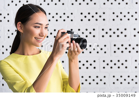 Elegant joyful young woman is enjoying her hobby 35009149