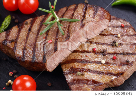 medium well grilled juicy beef steaks 35009845