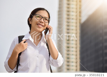 Woman with her mobile phone. Woman with her mobile phone. 35010221