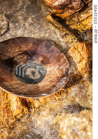 Wooden Pan for gold panning in a river in Thailand 35010400
