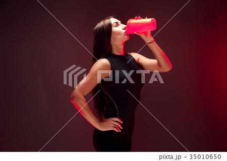 Sexy brunette with very long hair and sporting 35010650