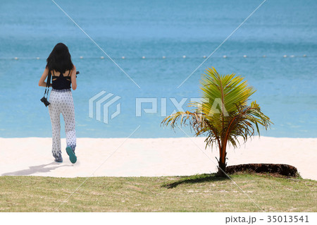 Beautiful girl wear asian-style dress on the beach 35013541