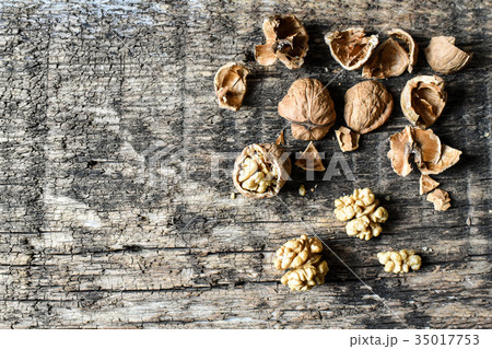 Delicious nuts on an old wooden table, copyspace Delicious nuts on an old wooden table, copyspace 35017753