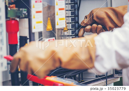 an engineer working on checking and maintenance equipment 35023779