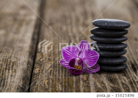 Spa stones and orchid close-up. 35025896