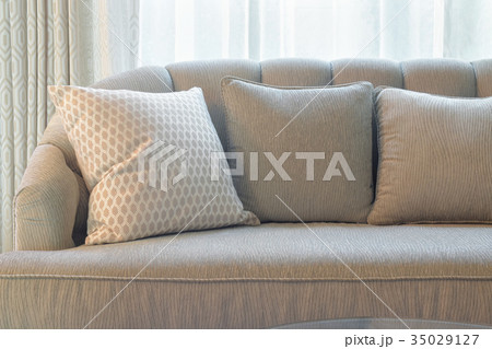 Comfy sofa with pillows in living room 35029127