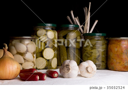 Jars with pickled vegetables on dark background 35032524