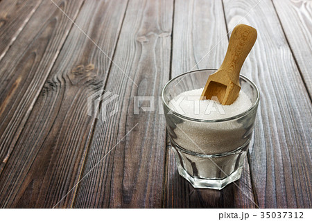 White granulated sugar in white cup 35037312