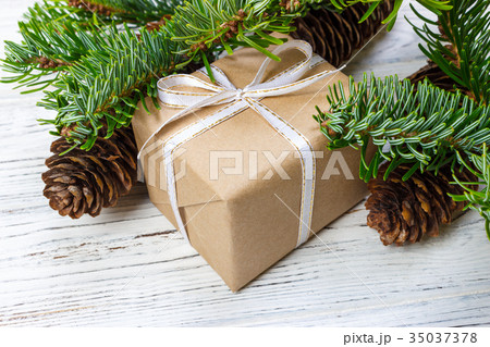 Christmas gift box on the white table background Christmas gift box on the white table background 35037378
