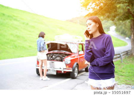 Women are a phone call to a repair center Women are a phone call to a repair center 35051697