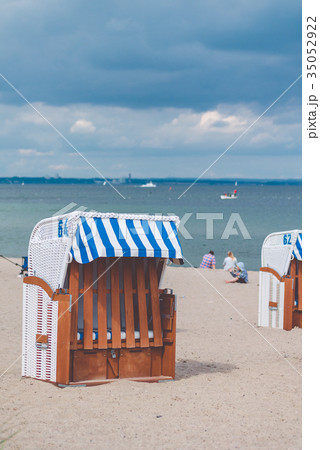 Blue striped roofed chairs on empty sandy beach in Blue striped roofed chairs on empty sandy beach in 35052922