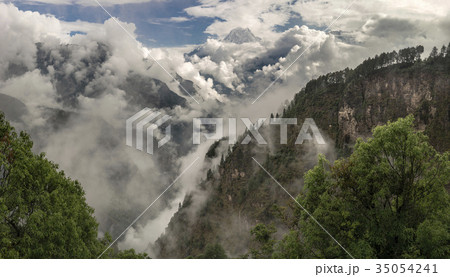 Nilgiri summit and cloudy Himalayas 35054241