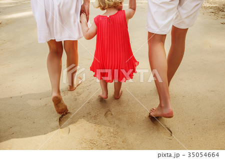 The family legs with little daughter on the beach The family legs with little daughter on the beach 35054664