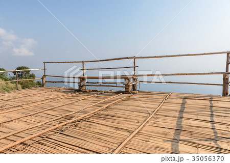 wooden bench on wooden floor near cliff wooden bench on wooden floor near cliff 35056370