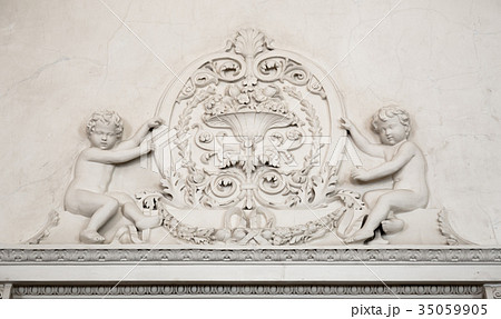 White abstract plaster background with angels White abstract plaster background with angels 35059905