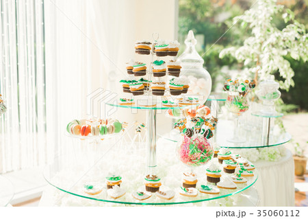 Delicious sweets on wedding candy buffet with 35060112