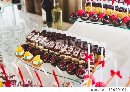 Different kinds of baked sweets on a buffet Different kinds of baked sweets on a buffet 35060161