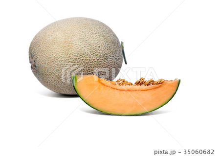 sliced melon to show the juicy flesh and seeds. 35060682