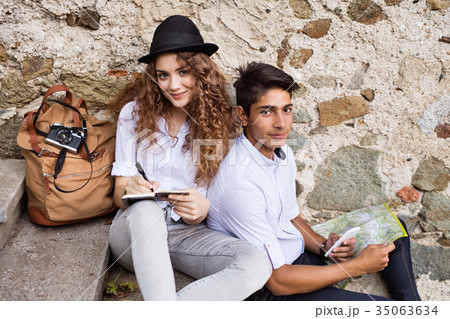 Two young tourists enjoying the day in the old 35063634