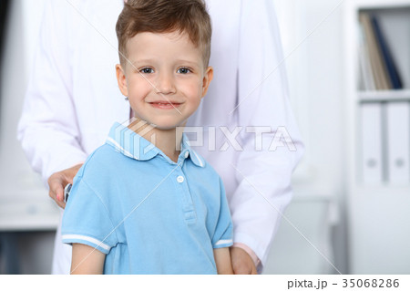 Doctor and patient in hospital. Happy little boy Doctor and patient in hospital. Happy little boy 35068286
