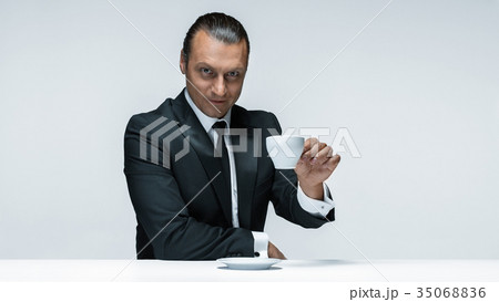 The attractive man in black suit on white 35068836