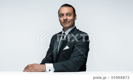 The attractive man in black suit on white 35068872