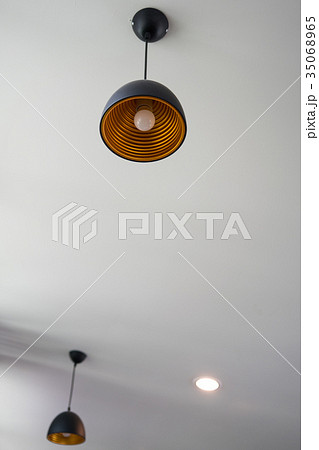 Light bulb hanging on a long wire 35068965