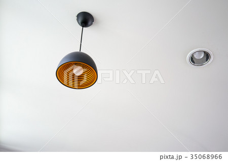 Light bulb hanging on a long wire 35068966