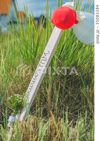 Welcome sign with ballons on sandy beach in Welcome sign with ballons on sandy beach in 35083384